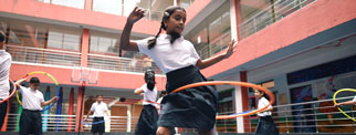 A young person doing hula hoop