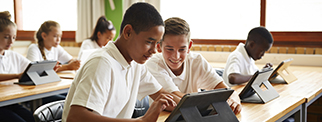 School students in class working with tablets