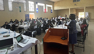 Delegates and speaker in a room